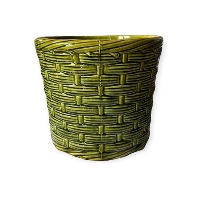 A beautifully textured vintage english planter featuring a classic wicker-weave moulded design, finished in a rich emerald...