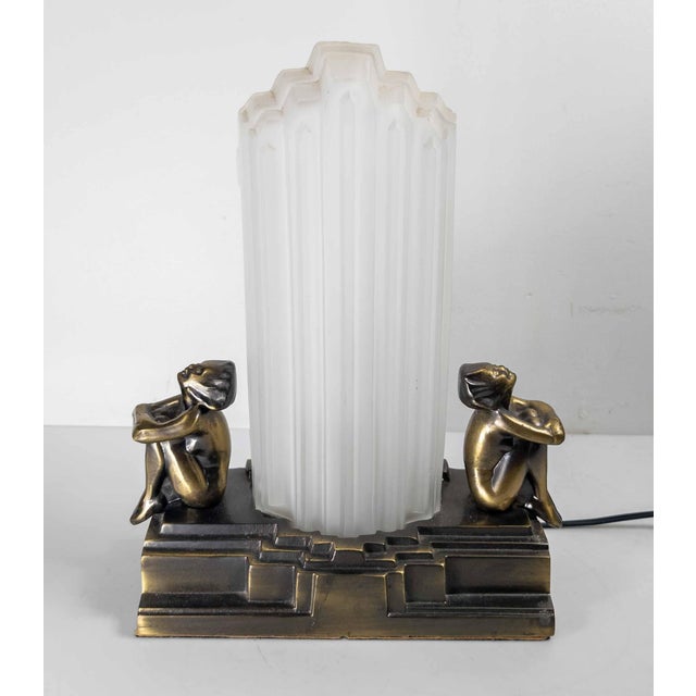 We are selling this mid-century table lamp in the Art Deco style. This lamp is made by Sarsparilla and is probably copied...