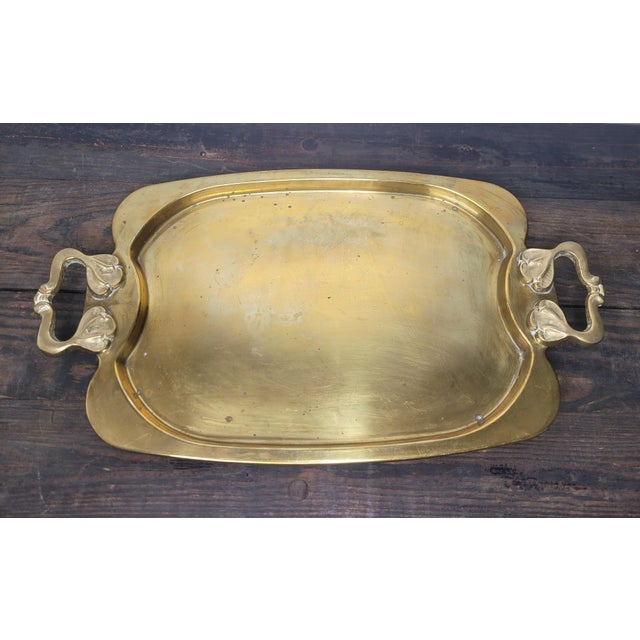 Elevate your bar cart or coffee table with this substantial vintage solid brass serving tray. Crafted in Korea during the...