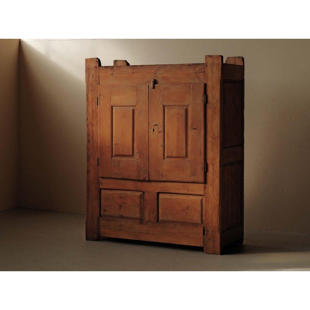 Folk Art cabinet, crafted in Auvergne in the 19th century, is made from solid pine and reflects traditional rural...