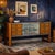 Elegant buffet cabinet with exposed drawers, central bar compartment covered with mirrors and back-treated glass (with...