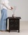 A side table whose black carved wood, openwork geometric panel sides gives it real character at first glance. Originating...