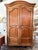 18th century French country fruitwood armoire with adjustable shelving.