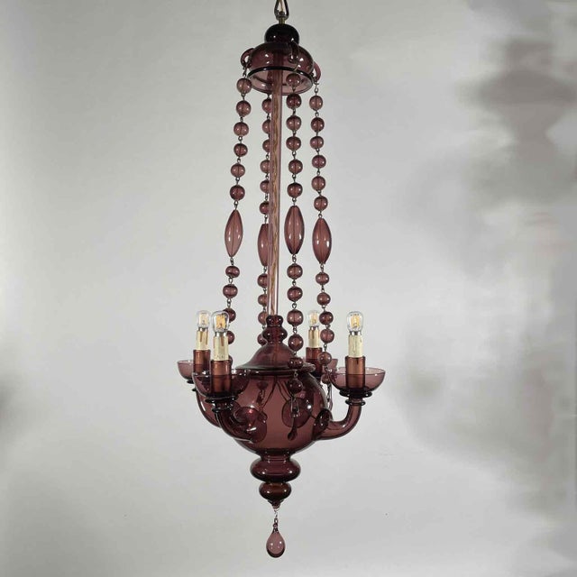 Venetian Amethyst-Colored Blown Glass Chandelier, Early 1900s, a four-light, Art Deco Murano glass pendant in the Venini...