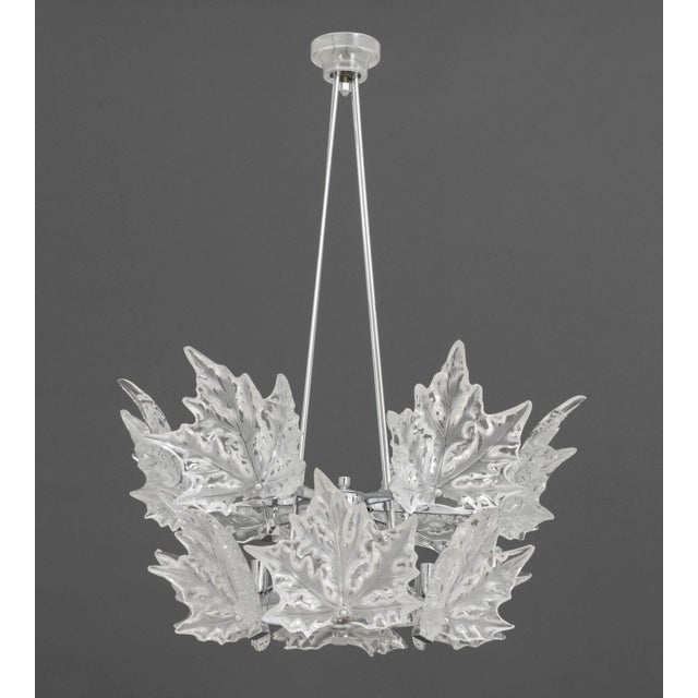 Lalique Champs-Elysees Two Tier Chandelier, twelve lights with molded clear and frosted leaf glass motif on chrome-plated...