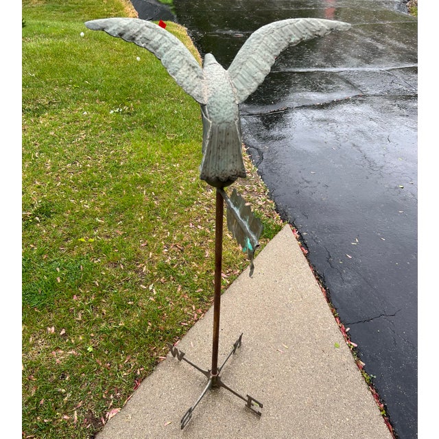 Vintage copper weathervane with N,E,W,S, moving arrows at bottom. The direction; letters are secured by tightening by a...