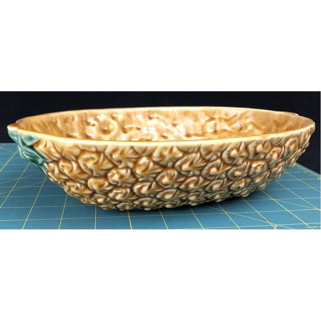 Bring a touch of playful elegance to your table with this charming vintage Bordallo Pinheiro serving bowl. Crafted in...