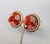 Late 1950s or early 1960s round goldtone with ribbed edges with red and pink aurora borealis cut beads in the center...
