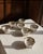 A complete and charming set of eight antique Japanese open salt cellars, each marked “Hand Painted NIPPON” — placing their...
