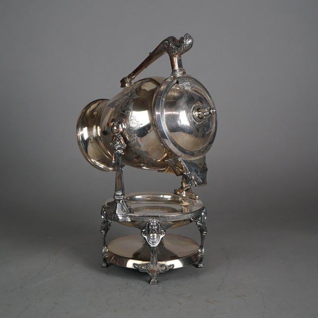 Antique Figural Silver Plated Tilting Tea Pot with Mask & Foliate Engraving C1890 Measures - 17.5"H x 10.5"W x 8"D