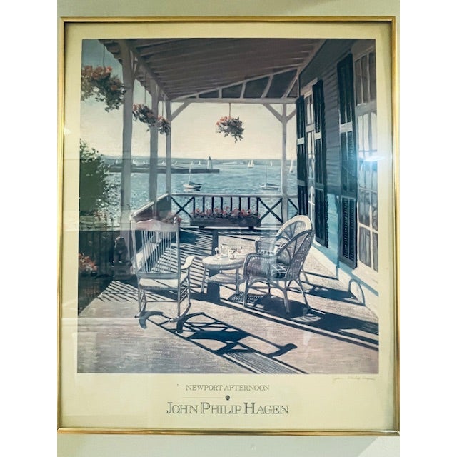 Bring the timeless charm of coastal New England into your home with this pencil-signed lithograph, "Newport Afternoon," by...