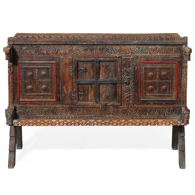 This antique wooden chest, known as a damchiya, was crafted in Gujara, Northern India, circa 1920. with its intricate...