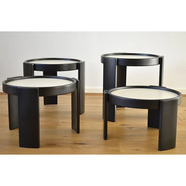 Early version of the set of 4 tables plus seat cushions in leather by Gianfranco Frattini for Cassina 1960s The tables are...