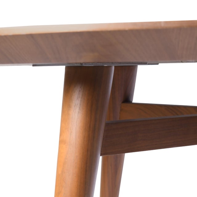 Mid-Century Modern Round Dining Table with Lazy Susan A classic mid-century modern round dining table featuring clean...