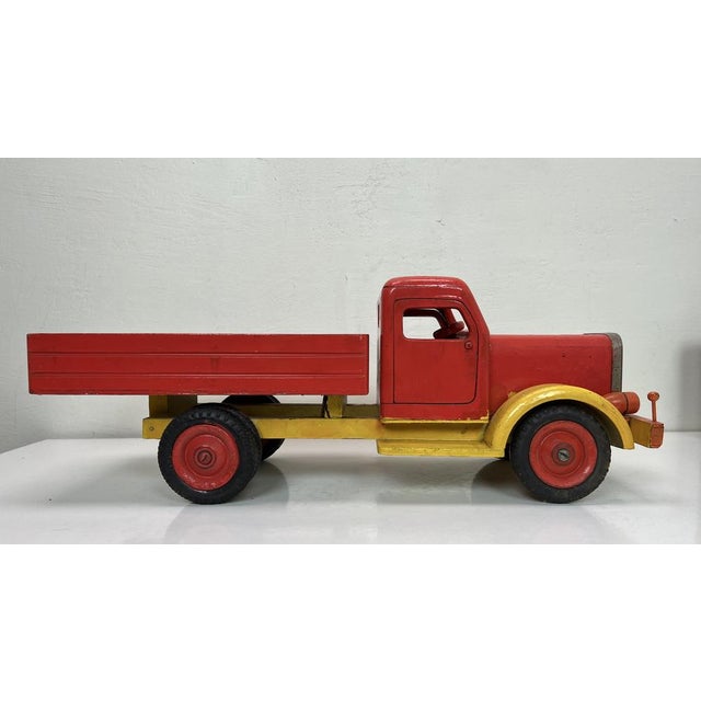 1950s Wooden Truck attributed to Bigge Germany. It has a great Mid Century appearance, with nice details and Dunlop tyres....