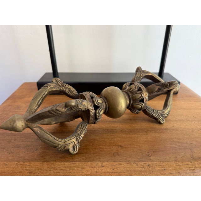 20th century gilt bronze Chinese Tibetan Buddhist vajra dorje object on stand. A substantial piece to add interest and...