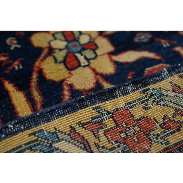 The cusped, flattened red medallion hosts escutcheon red pendants, each developing chains of secondary pendants. The navy...