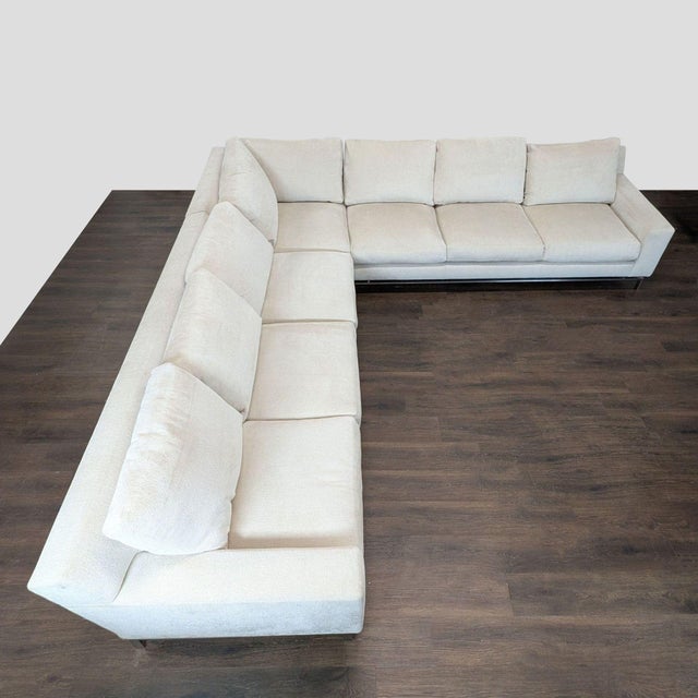 This A. Rudin sectional features a clean, modern design with a light beige fabric and sturdy metal legs. The spacious...