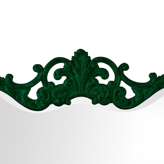 The Talida Mirror is a lovely piece featuring an ornate, textured frame adorned with decorative flourishes. The entire...