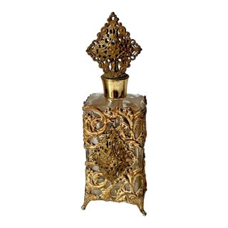 Vintage Ormolu Perfume Bottle With an Ornate Metal Filigree Casing and a Stopper. For Sale