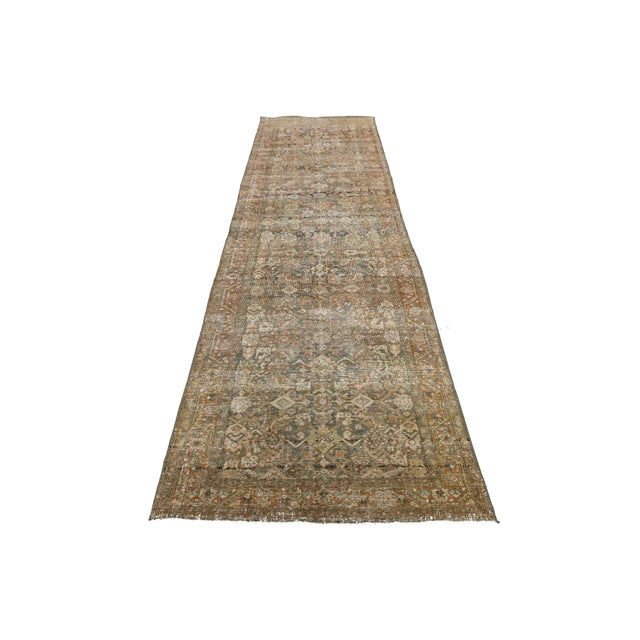 Elevate your space with time-worn elegance. Hand-knotted during the late 19th century, this exquisite Antique Malayer Wool...