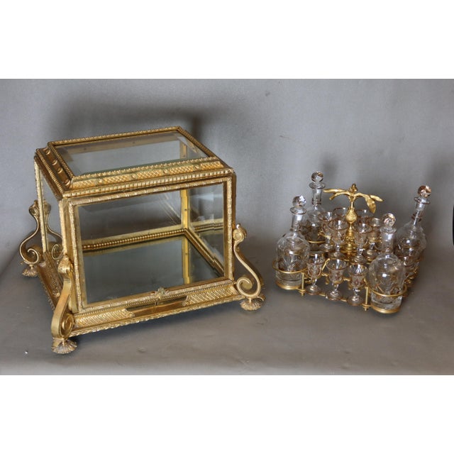 Beautiful napoleon iii period gilt bronze liquor cabinet. It holds 16 glasses and 4 decanters. The finely crafted bronze...