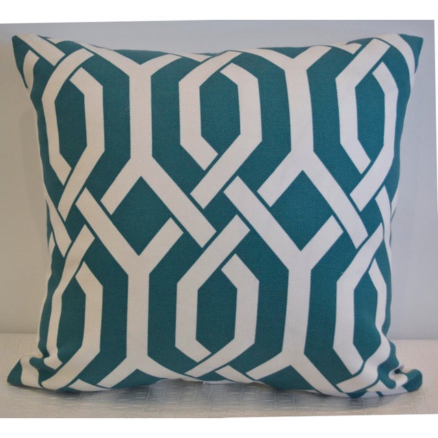 A teal and white lattice print cotton pillow with a solid white linen back. 22" x 22". Down insert.