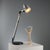 Table lamp designed in the 1990s by Makio Hasuike and Hisham Kulhanek, crafted with a combination of plastic, aluminum,...