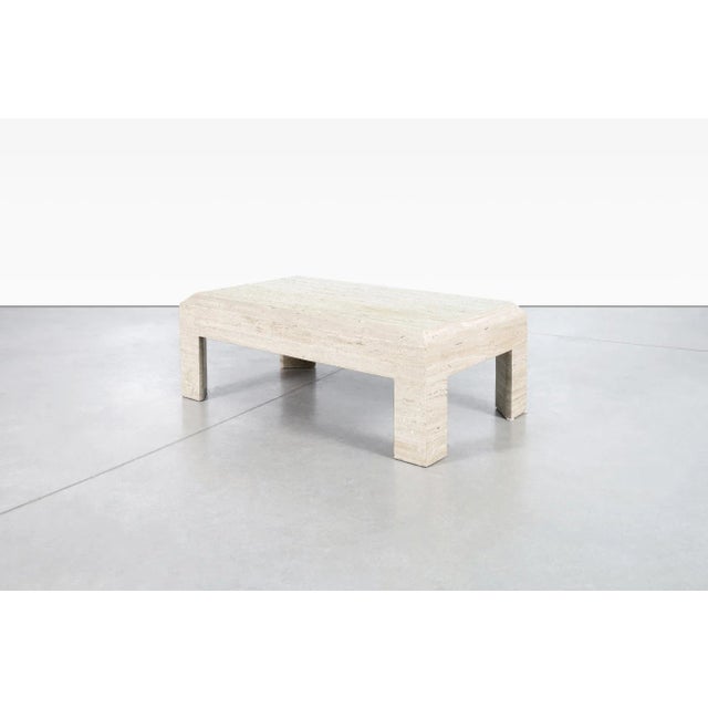 Crafted in Italy during the 1970s, this vintage Italian Modern coffee table celebrates the timeless beauty of natural...