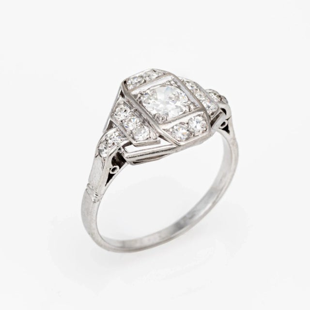 Finely detailed vintage French Art Deco diamond ring (circa 1920s to 1930s) crafted in 900 platinum. Centre set old...