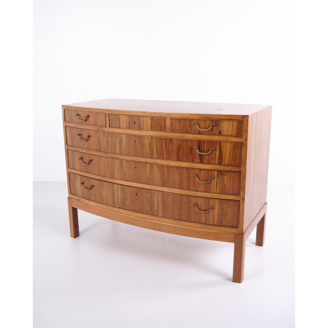 Chest of drawers from the 1940s designed by Ole Wanscher. Made in walnut veneer with brass handles and characteristic...