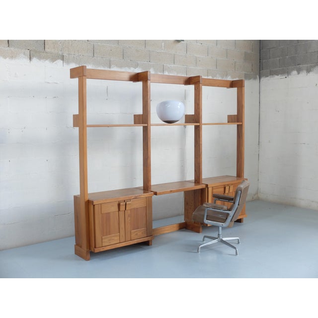 Furniture made of varnished solid elm wood, modular upon request. Writing modules, drawers and double doors available....