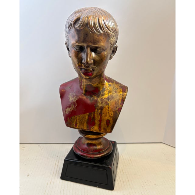 Classical bust of the Roman Emperor Augustus Caesar. The sculpture crafted from plaster or a similar composition material,...