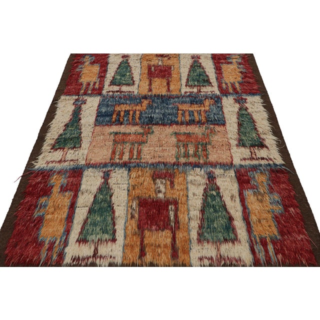 Hand-knotted in wool, this 6x7 Moroccan flatweave rug made by our partners in India, features pictorial depictions of...