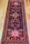 A vintage Persian Hamadan gallery rug, hand-knotted in western Iran in the early 20th century. This elongated gallery-...