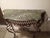 Beautiful vintage French-style console table featuring a genuine green variegated marble top and a heavy, ornately crafted...