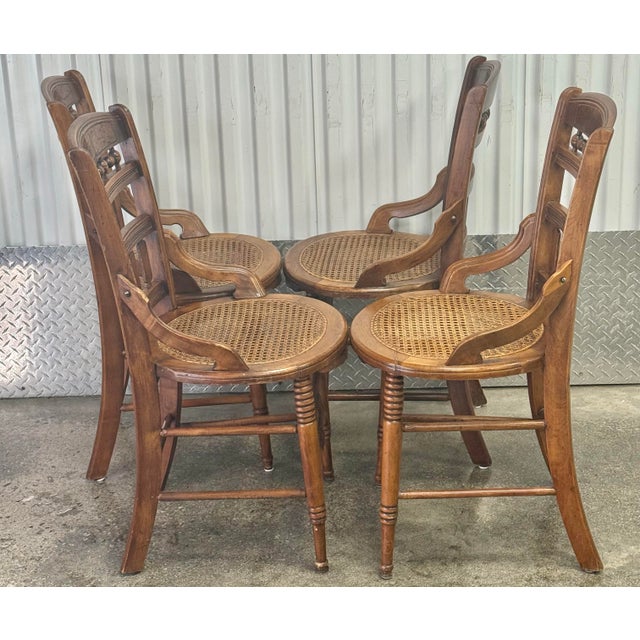 Gorgeous patina on these late 19th century chairs! Solid walnut frame with burled inset at crest, hand woven cane seats,...