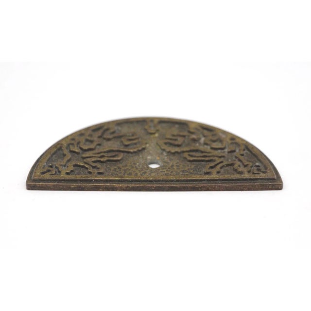 Cast brass arched applique with a center hole for any application. The original mounting screws are not available. Good...