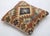A one-of-a-kind handwoven Afghan wool kilim accent pillow featuring a concentric diamond medallion in rust, cream and...