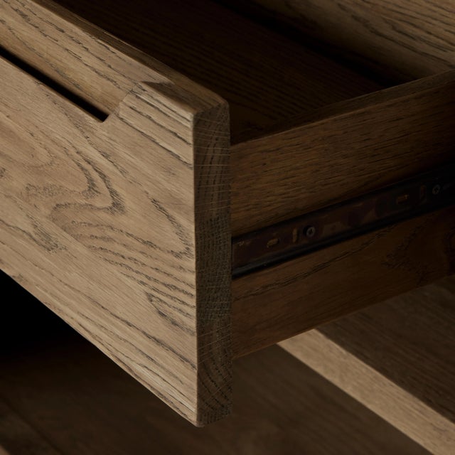 Drifted oak frames the interior shelving of this double cabinet. Glass doors allow for prized possessions to dazzle on...
