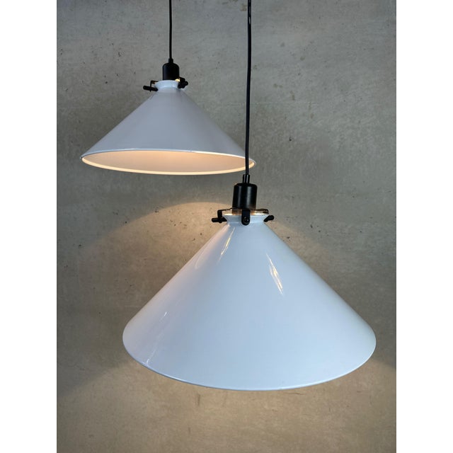 Two large metal pendant lamps from the 1980s. Remarkable lampshade holder. Bakelite E27 socket, aluminium shade holder....