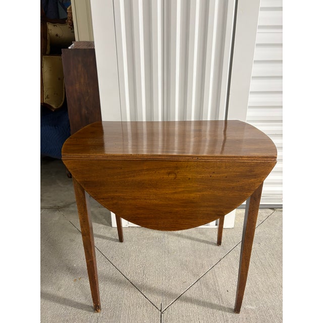 English Drop Leaf Table, 19th Century. French polished. Dimensions when opened 29" w x 36" d x 27.75" h