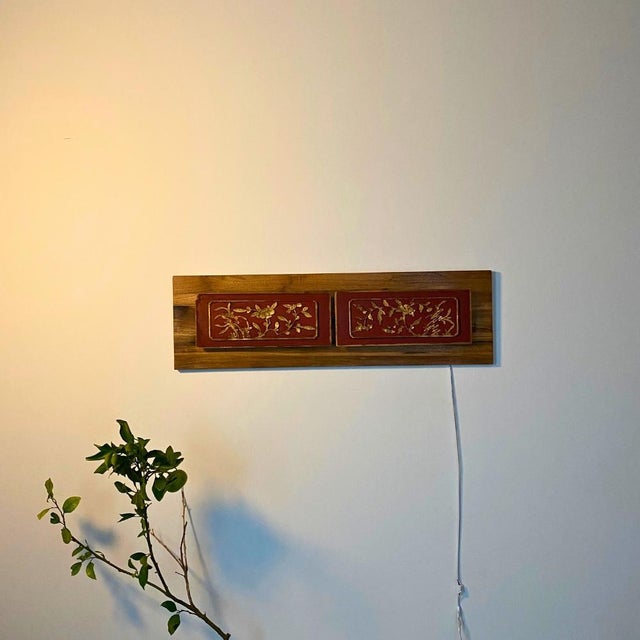 A pair of early 20th-century Chinese architectural panels, reimagined as an illuminated wall sculpture — equally striking...