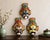A wonderfully colorful set of three vintage Chinese hand-painted wall masks inspired by the elaborate painted-face...