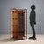 Art Nouveau display cabinet in walnut and stained beech. Central body with a quadripartite door with beveled glass, four...