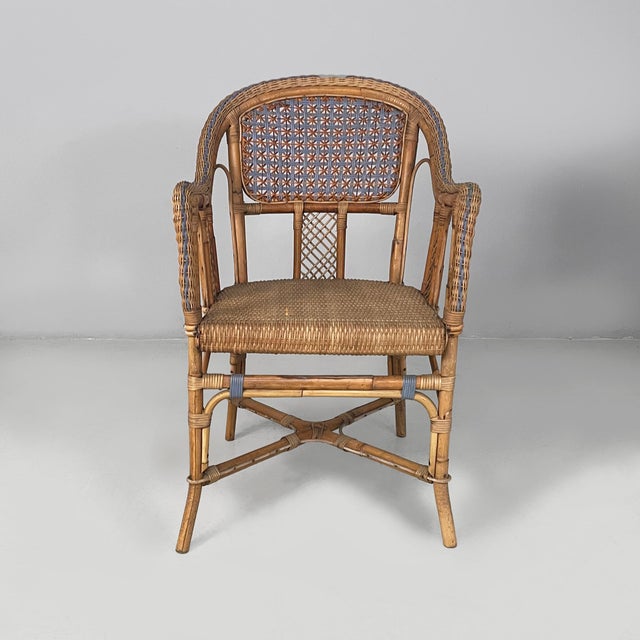 Italian Art Nouveau chairs with armrest in rattan and light blue rattan, early 1900s Pair of chairs with armrest in finely...
