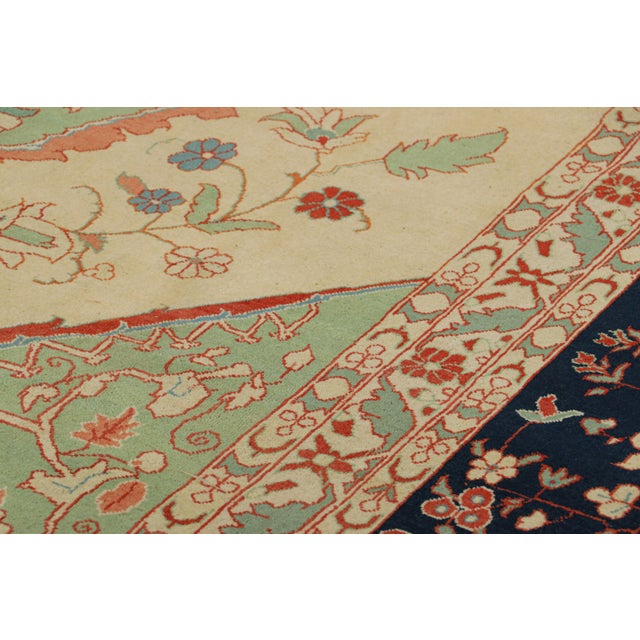 Hand-knotted in wool circa 1900-1910, this 12x18 antique Persian Tabriz rug is a rare and regal new curation from the Rug...