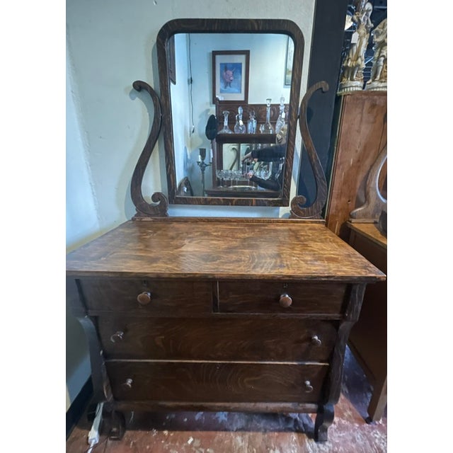 Antique quarter-sawn tiger oak dresser with tilting mirror, from the early 20th century. Solid wood 4-drawer dresser with...
