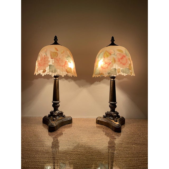 Bring timeless elegance to any interior with this beautifully matched pair of vintage reverse-painted floral boudoir...