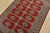 A tribal Bokhara Jaldar rug hand-knotted with fine wool on a cotton foundation. This rug features rows of repeating...